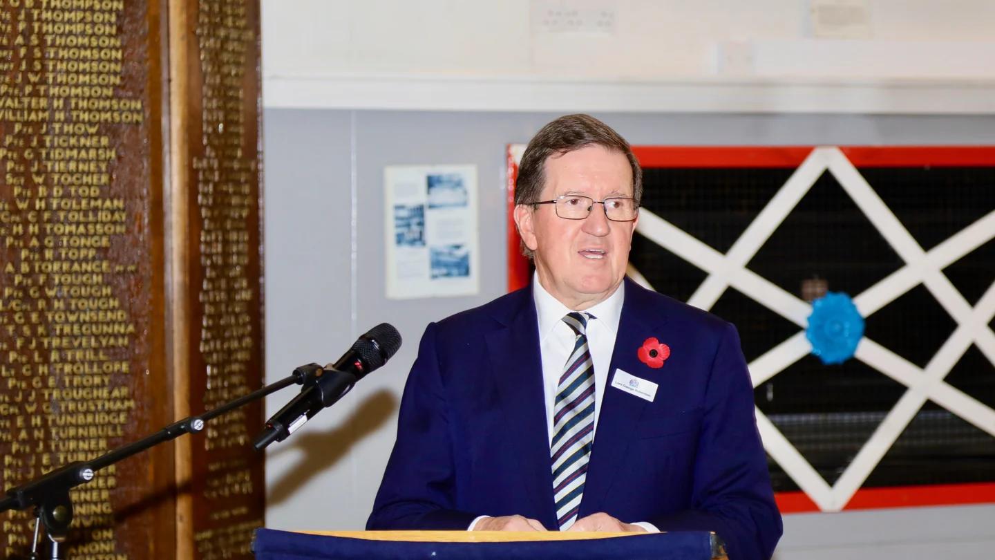 A speaker addresses a joint livery event from a lectern.
