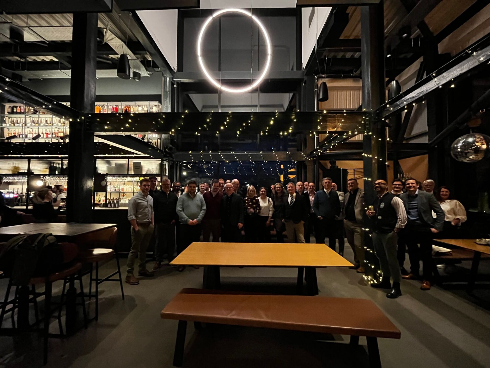 The group under a ring light in the Port of Leith Distillery bar