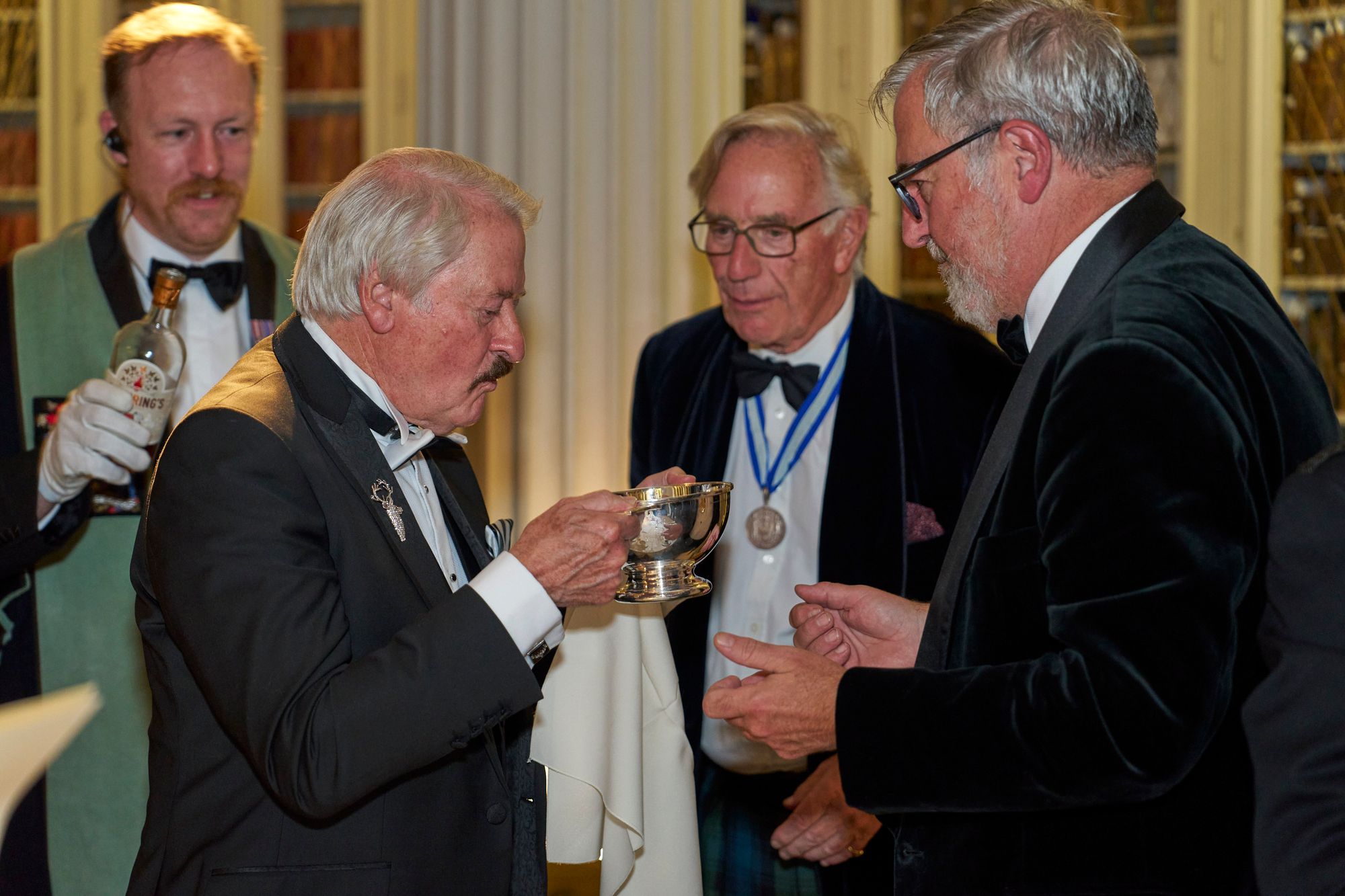 The Loving Cup passed at the Scotland Dinner, with a bottle of sloe gin