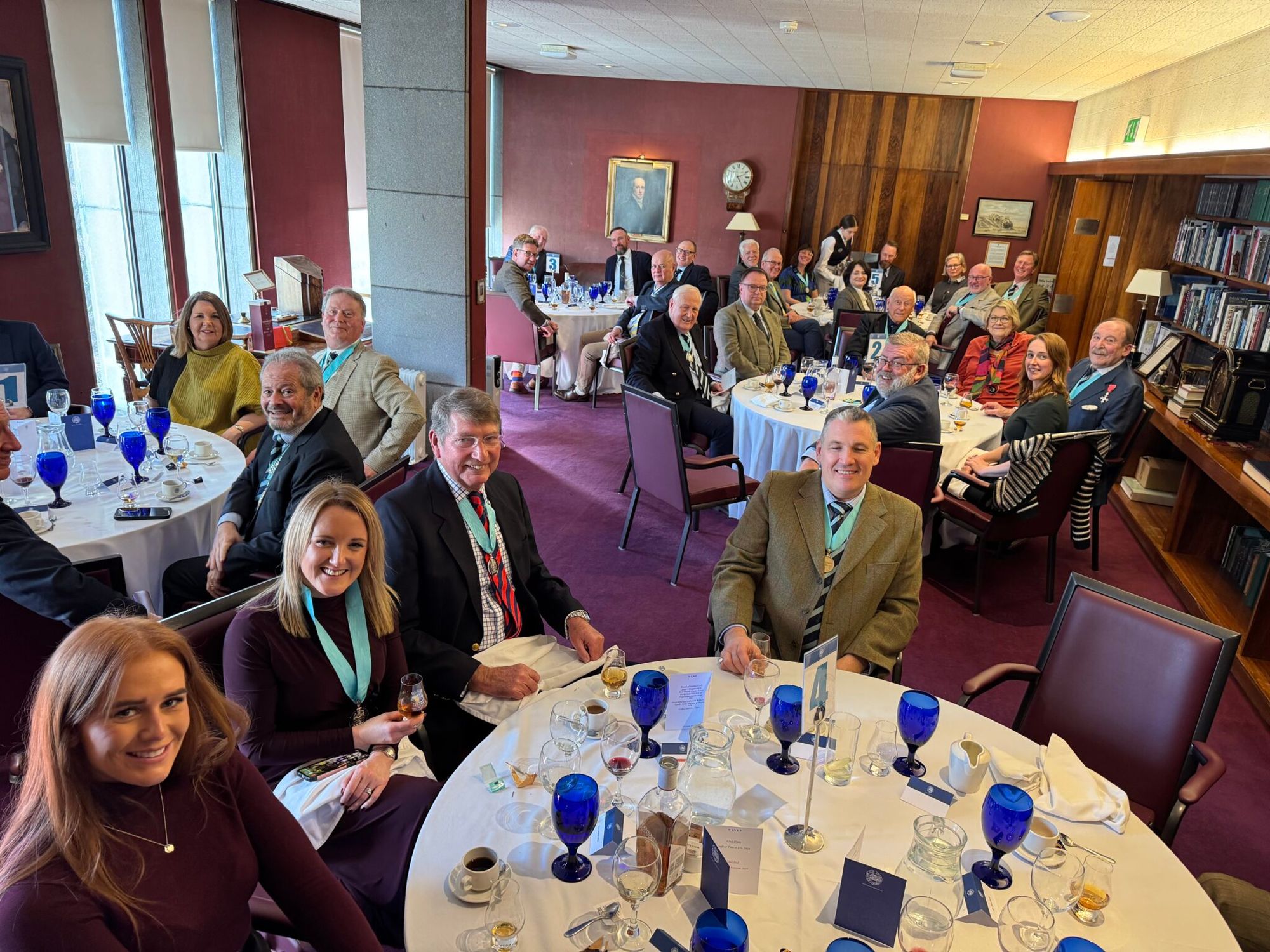 Lunch in the New Club dining room, with blue glassware on the tables