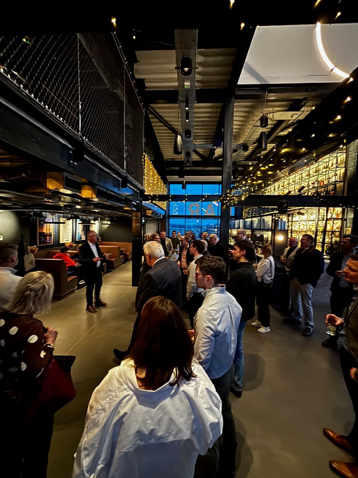 People mingling at the Master’s Bar