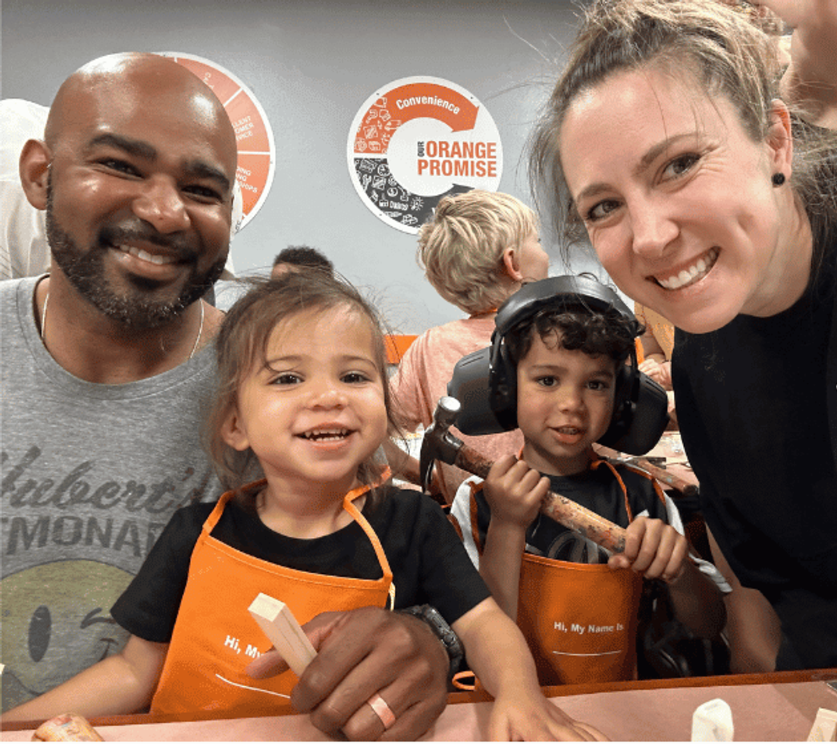 Kelsey Russell with her husband Brandon and their two children at a children’s workshop.