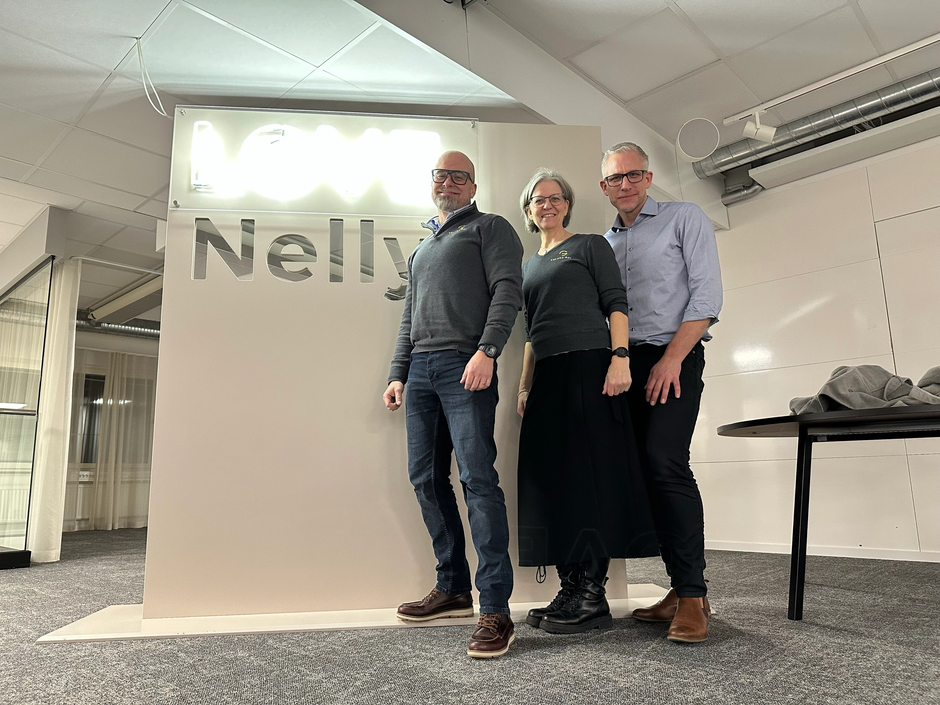 Toni, Sara and Rickard in front of a Nelly backdrop