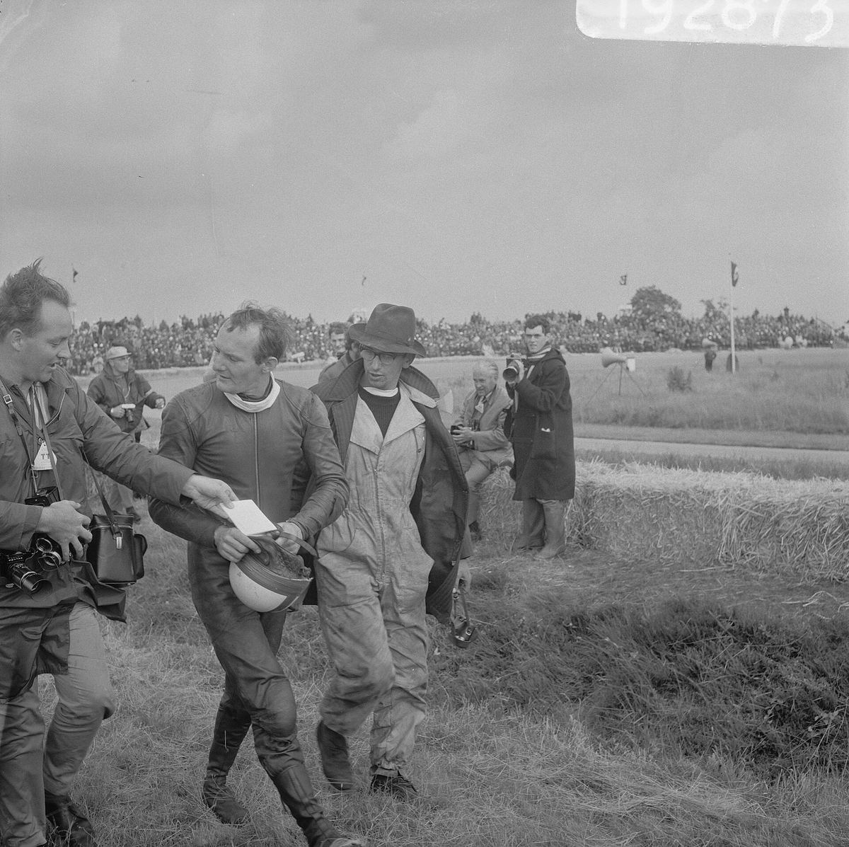 Mike Hailwood walking back to the pits after crashing in the 500cc race at Assen, 1966