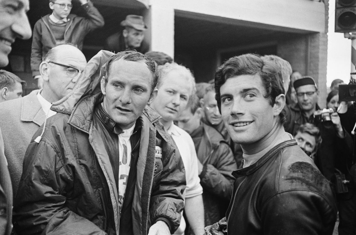 Mike Hailwood and Giacomo Agostini together in the riders' paddock at Assen, 1967