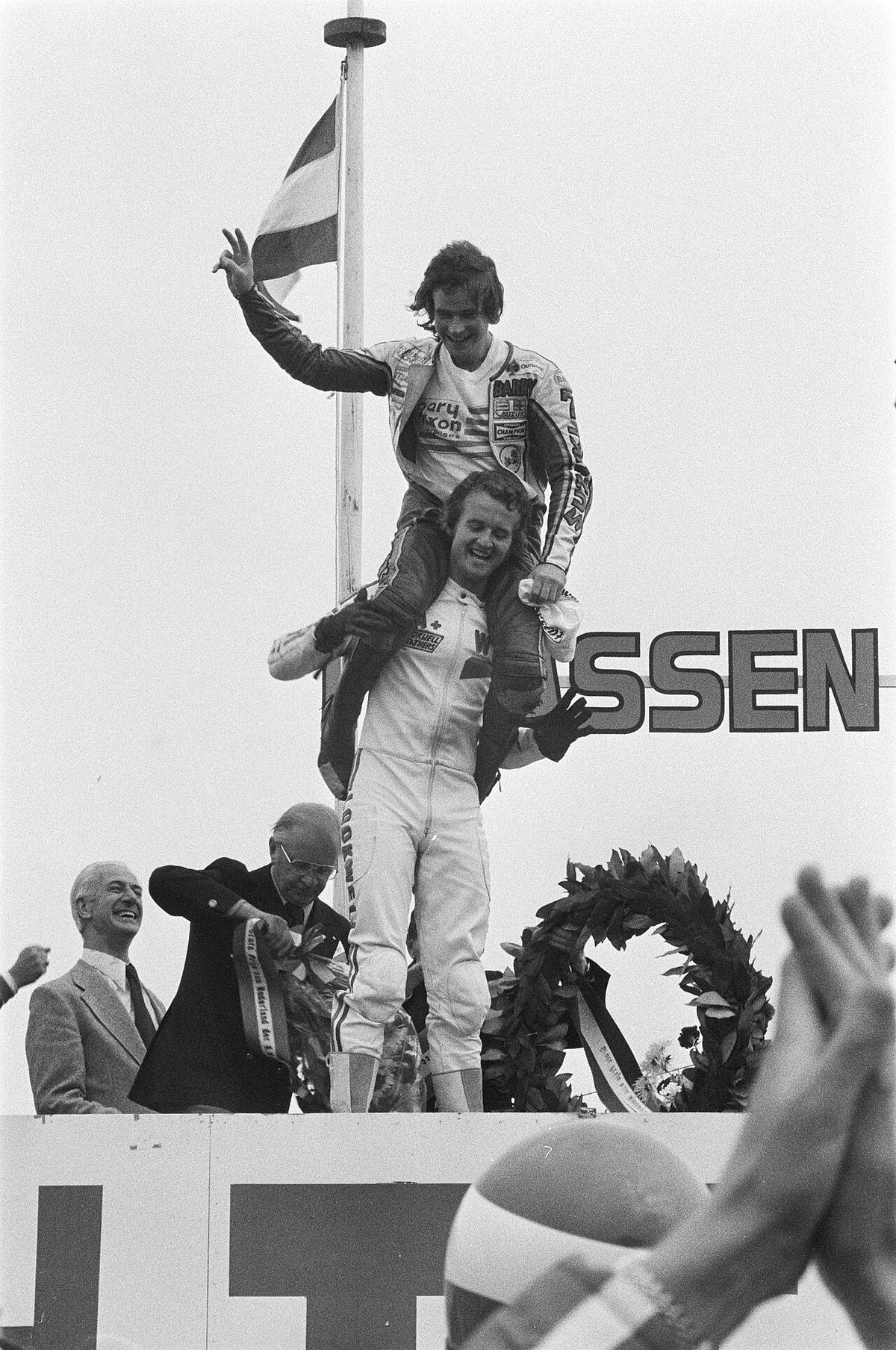 Wil Hartog with Barry Sheene sitting on his shoulders after the 500cc race at Assen, 1977