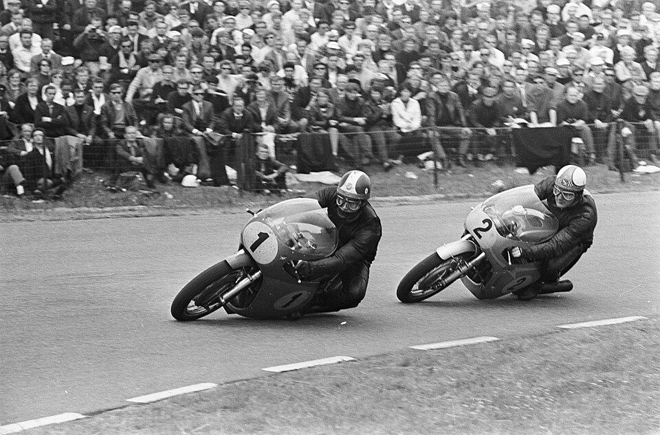 Mike Hailwood, number 2 on a Honda, chases Giacomo Agostini, number 1 on an MV Agusta, at Assen in 1967