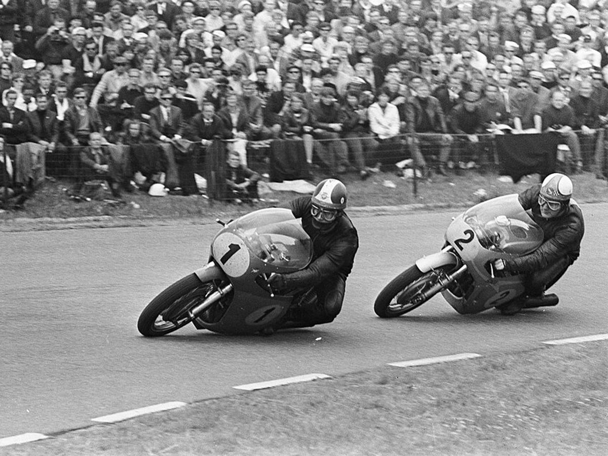 Mike Hailwood, number 2 on a Honda, chases Giacomo Agostini, number 1 on an MV Agusta, at Assen in 1967