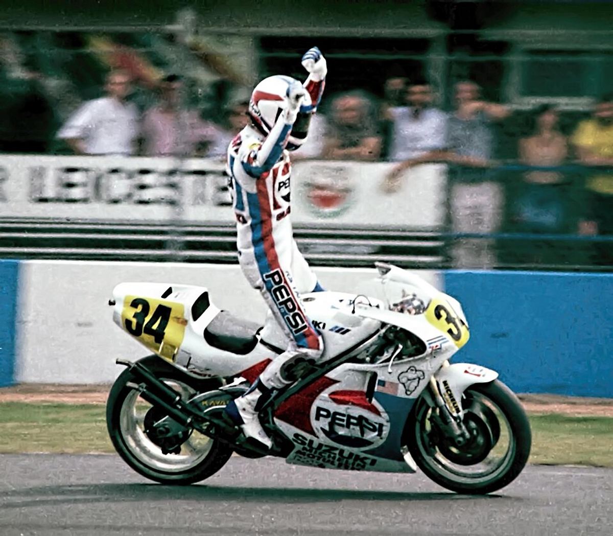 Kevin Schwantz celebrating on the Pepsi Suzuki after winning the 1989 British Grand Prix at Donington Park