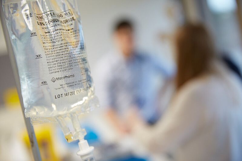 An IV bag being delivered to a patient