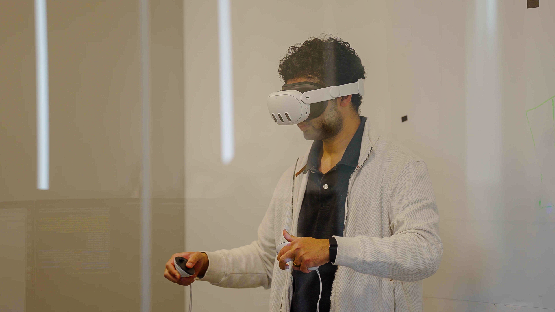 An operator controlling Vega with a VR headset and hand controllers An operator controlling Vega with a VR headset and hand controllers