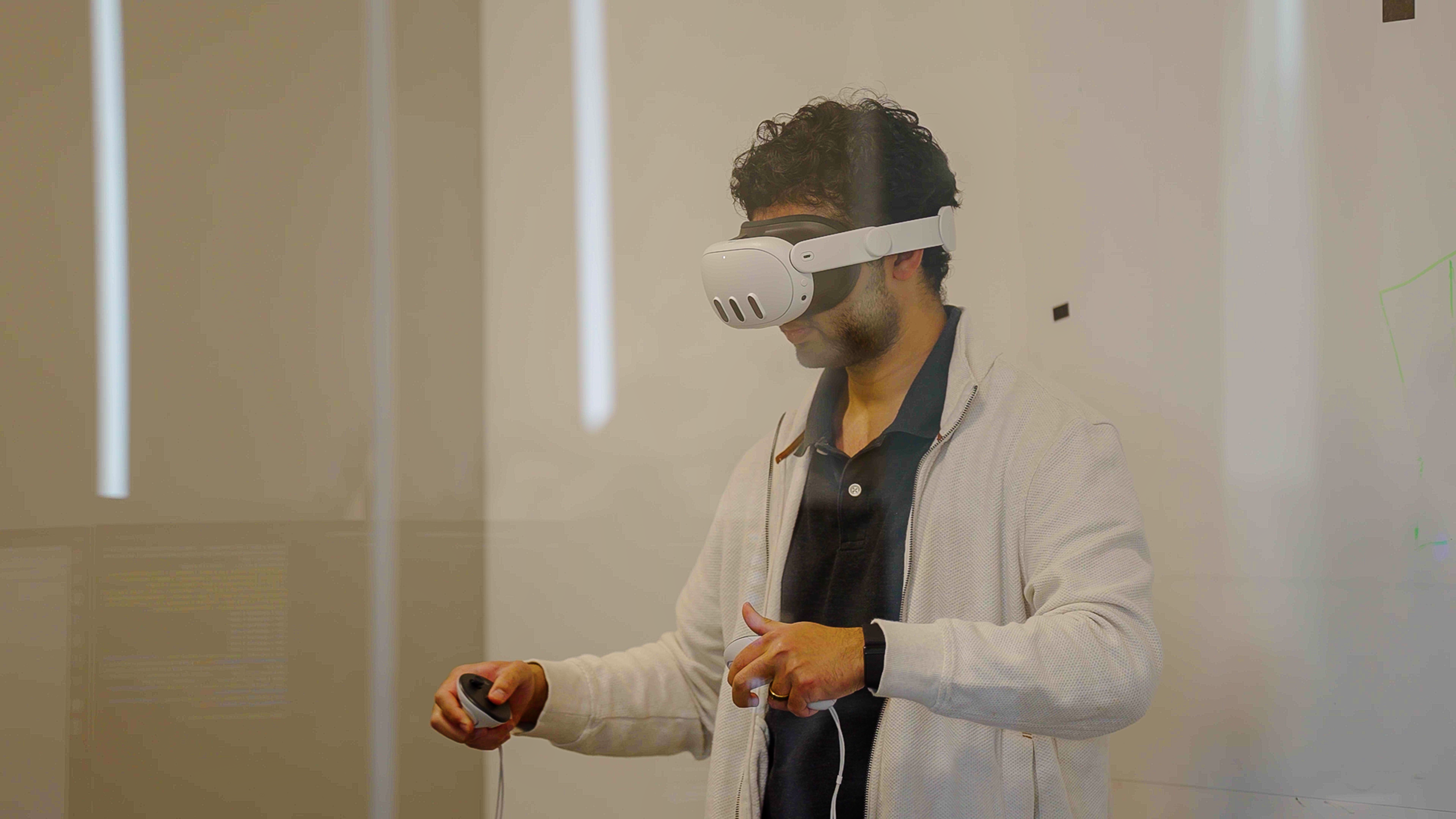 An operator controlling Vega with a VR headset and hand controllers