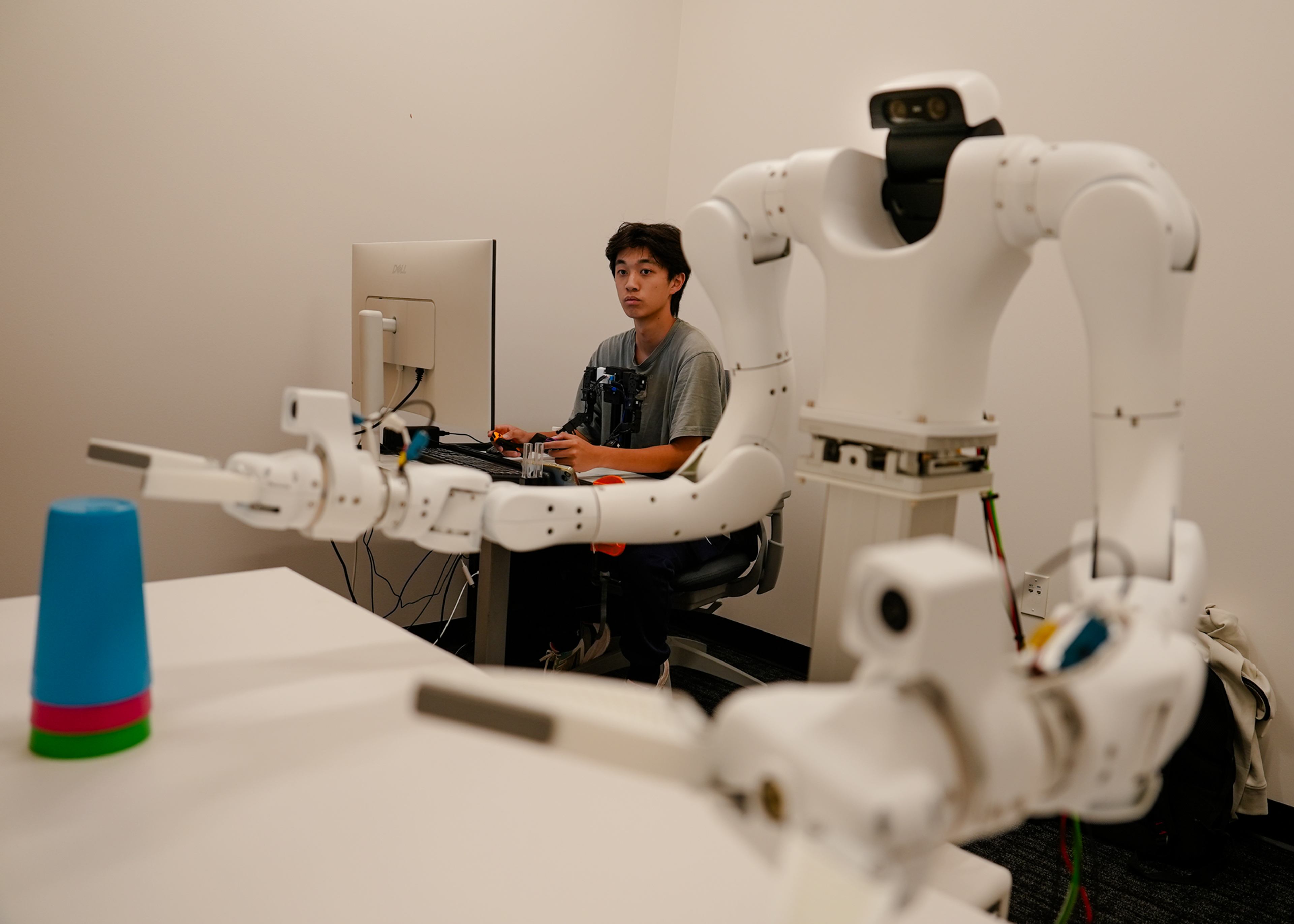 Humanoid robot sorting boxes in a warehouse