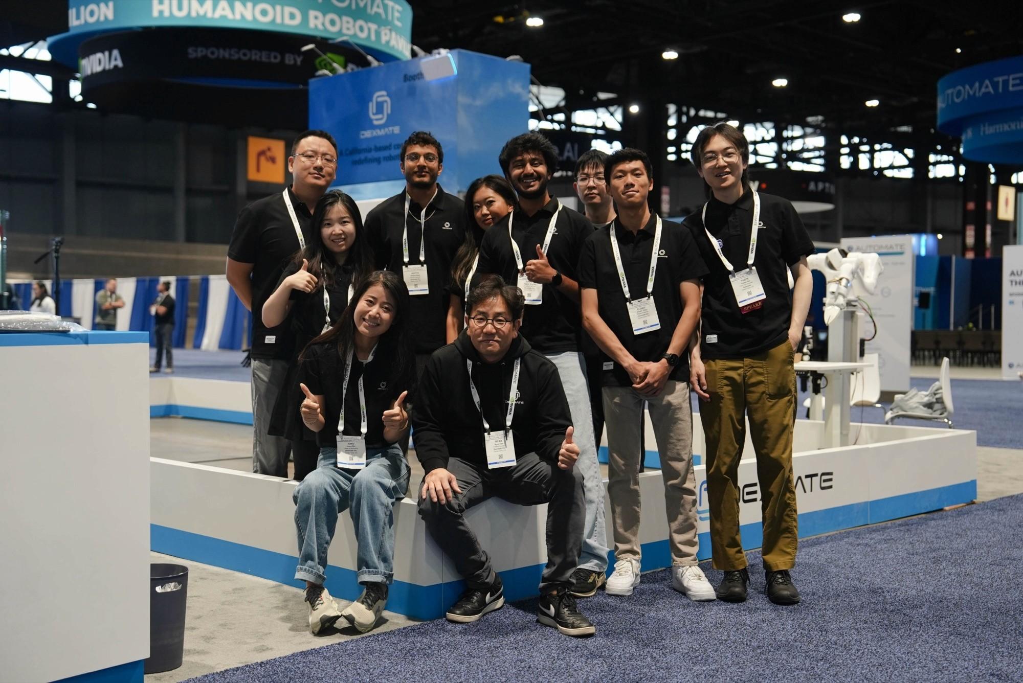 The Dexmate team at a trade show booth