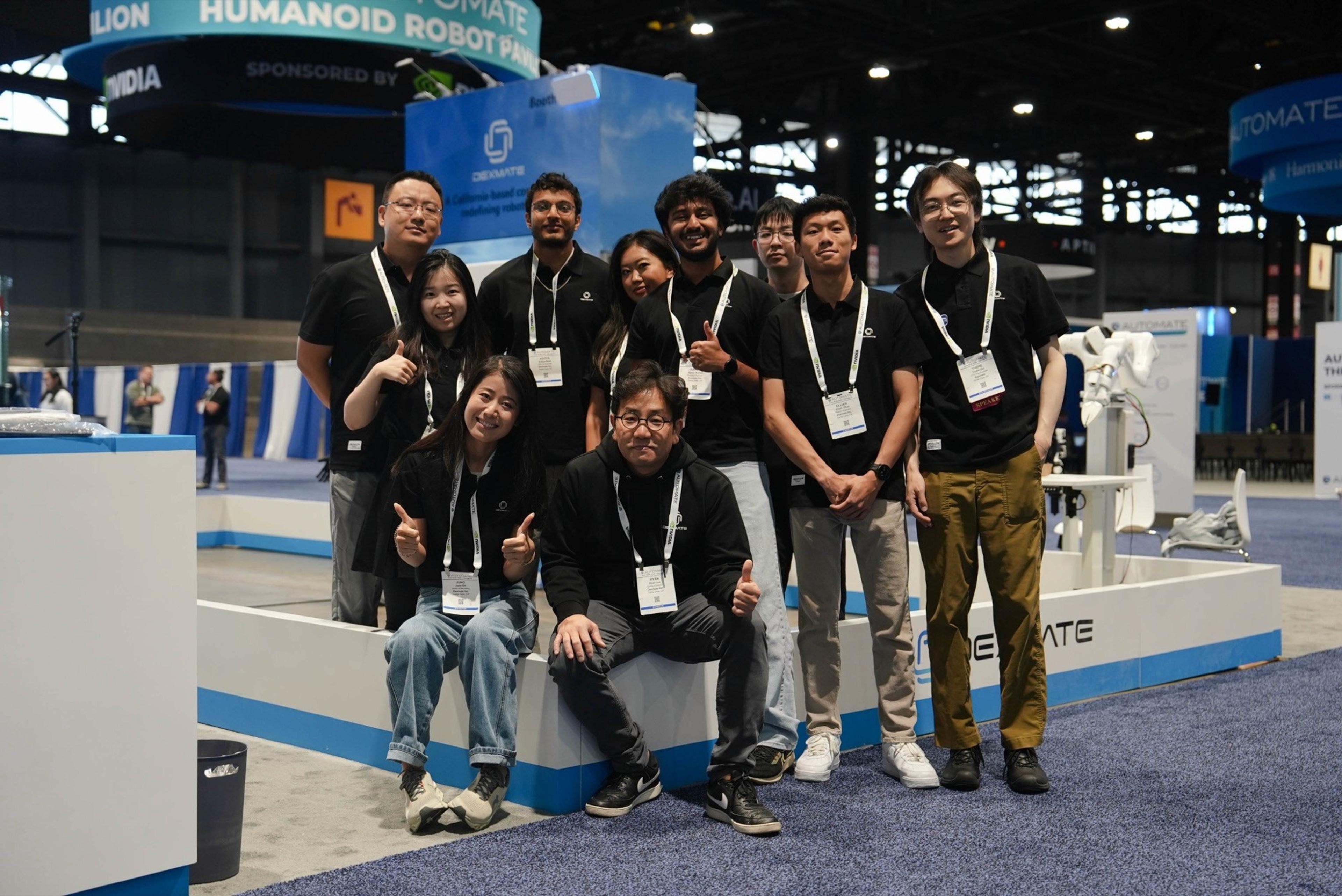 The Dexmate team at a trade show booth