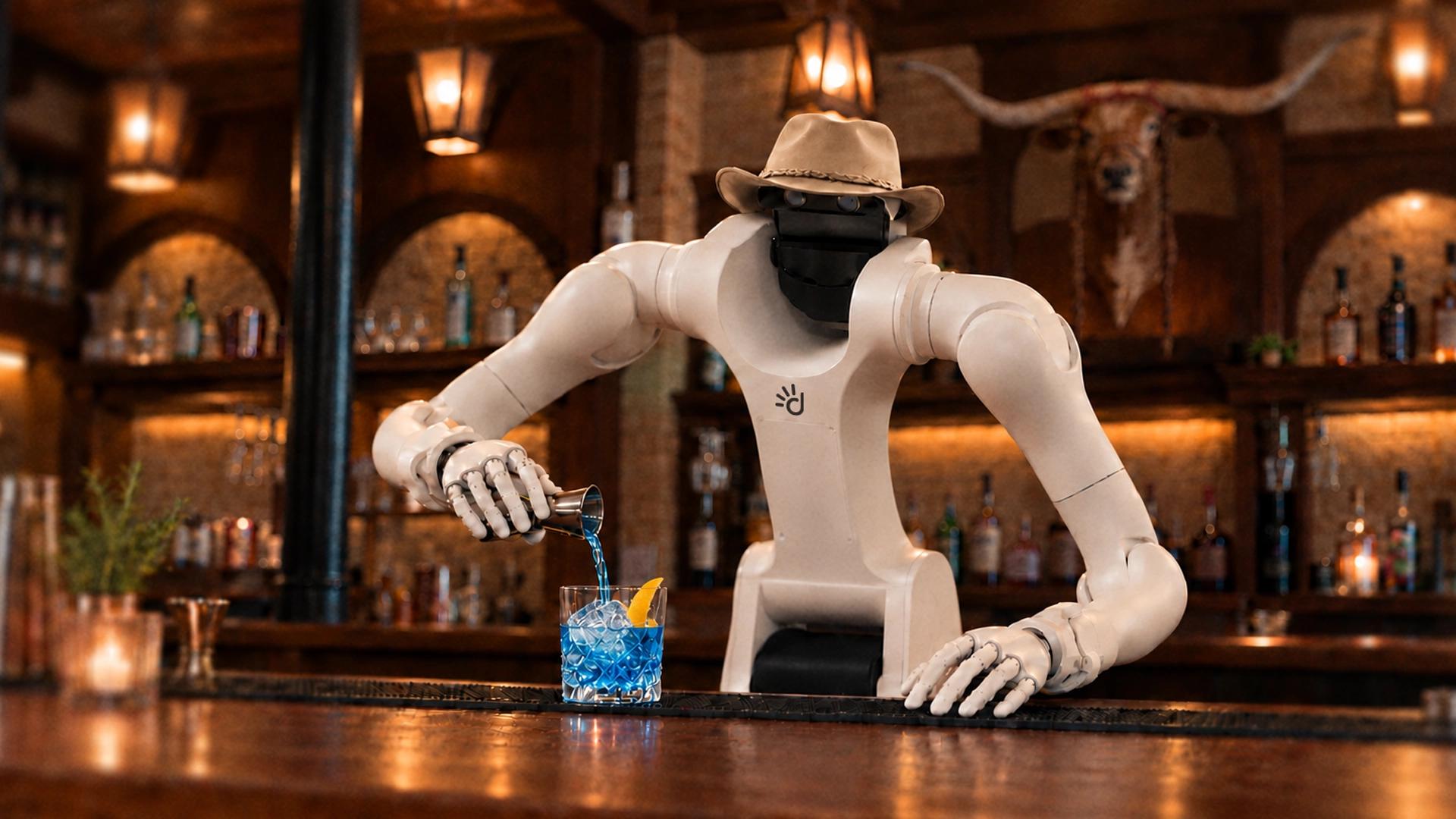 Vega in a cowboy hat preparing a drink for the CoRL happy hour at Speakeasy.