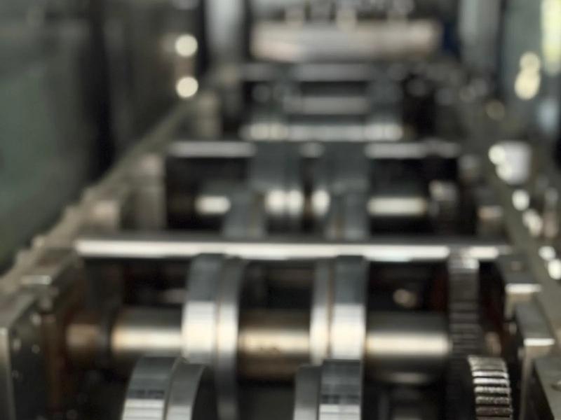 Roll-forming machine producing light gauge steel frames