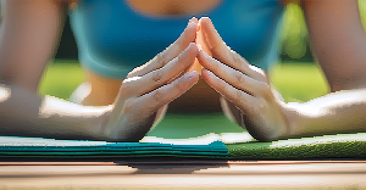 Close-up of hands in a meditative pose on a yoga mat in a peaceful outdoor setting.
