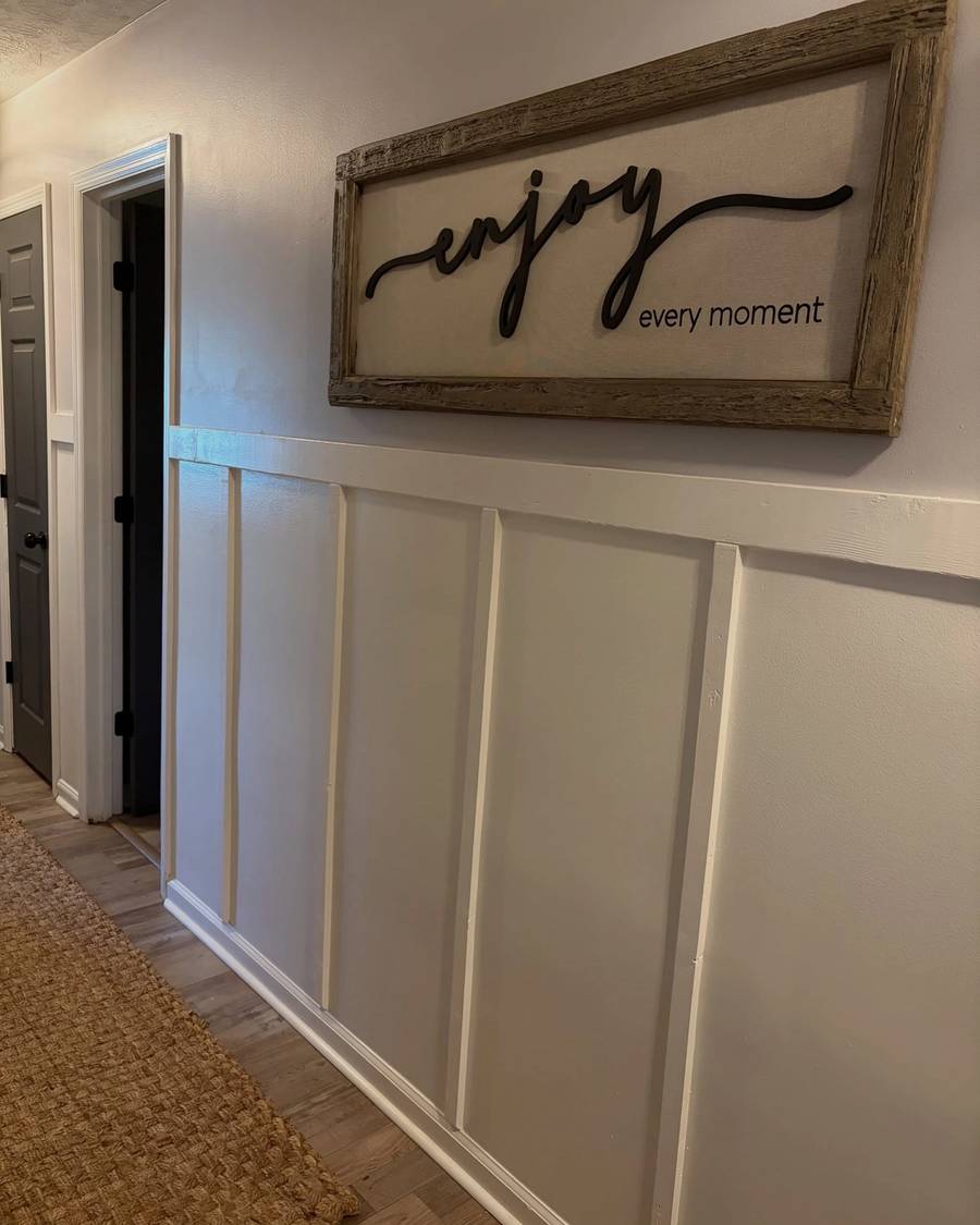 Hallway finished with white board and batten under an "enjoy every moment" sign