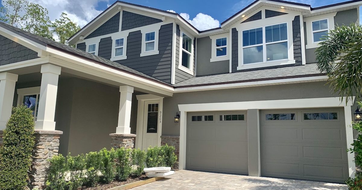 Two-story craftsman-style new construction home with a two-car garage in a Central Florida community