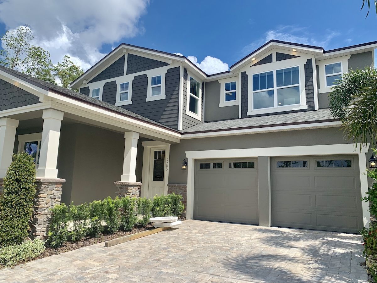 Two-story craftsman-style new construction home with a two-car garage in a Central Florida community