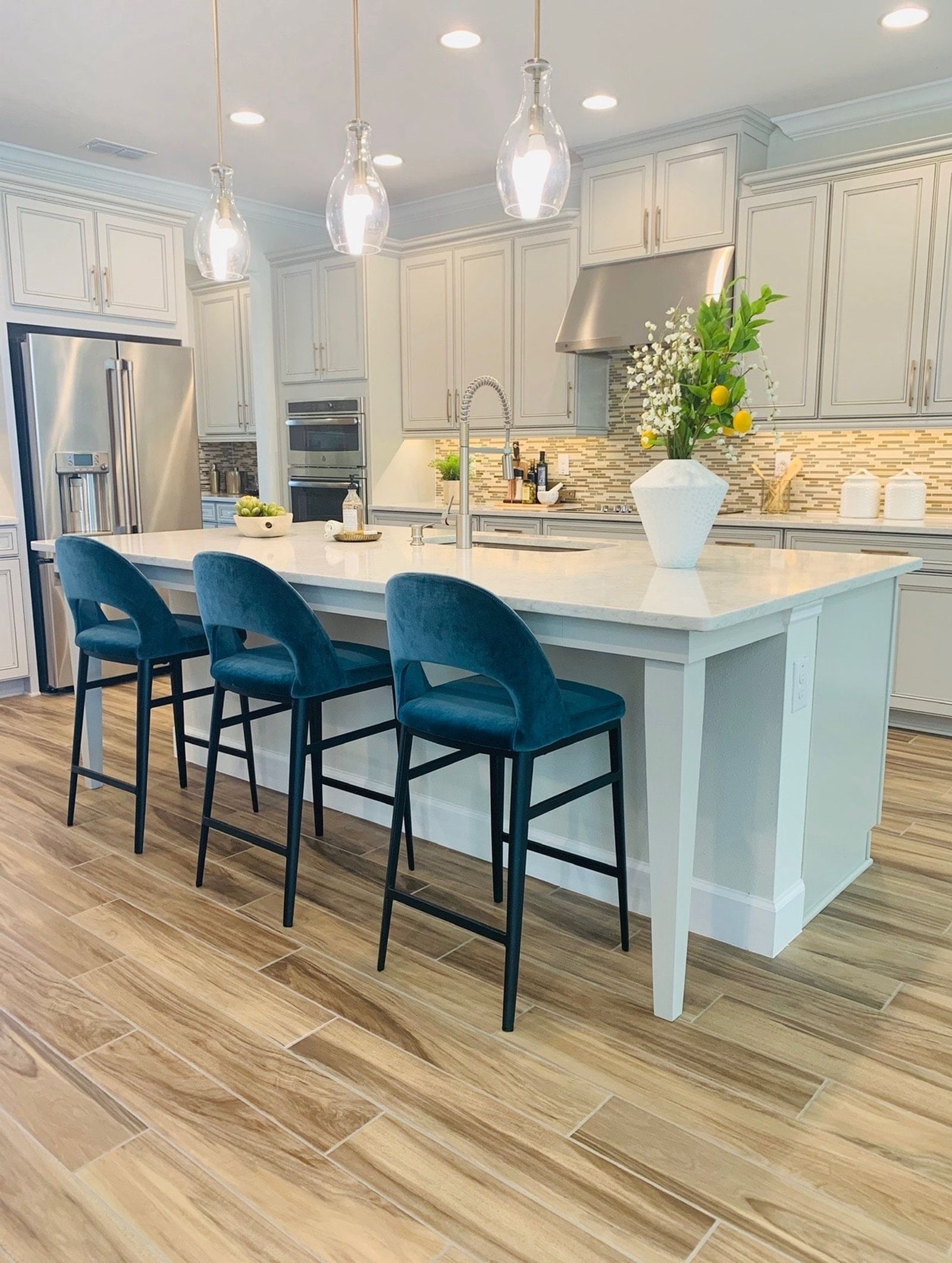 Blue stools in white kitchen