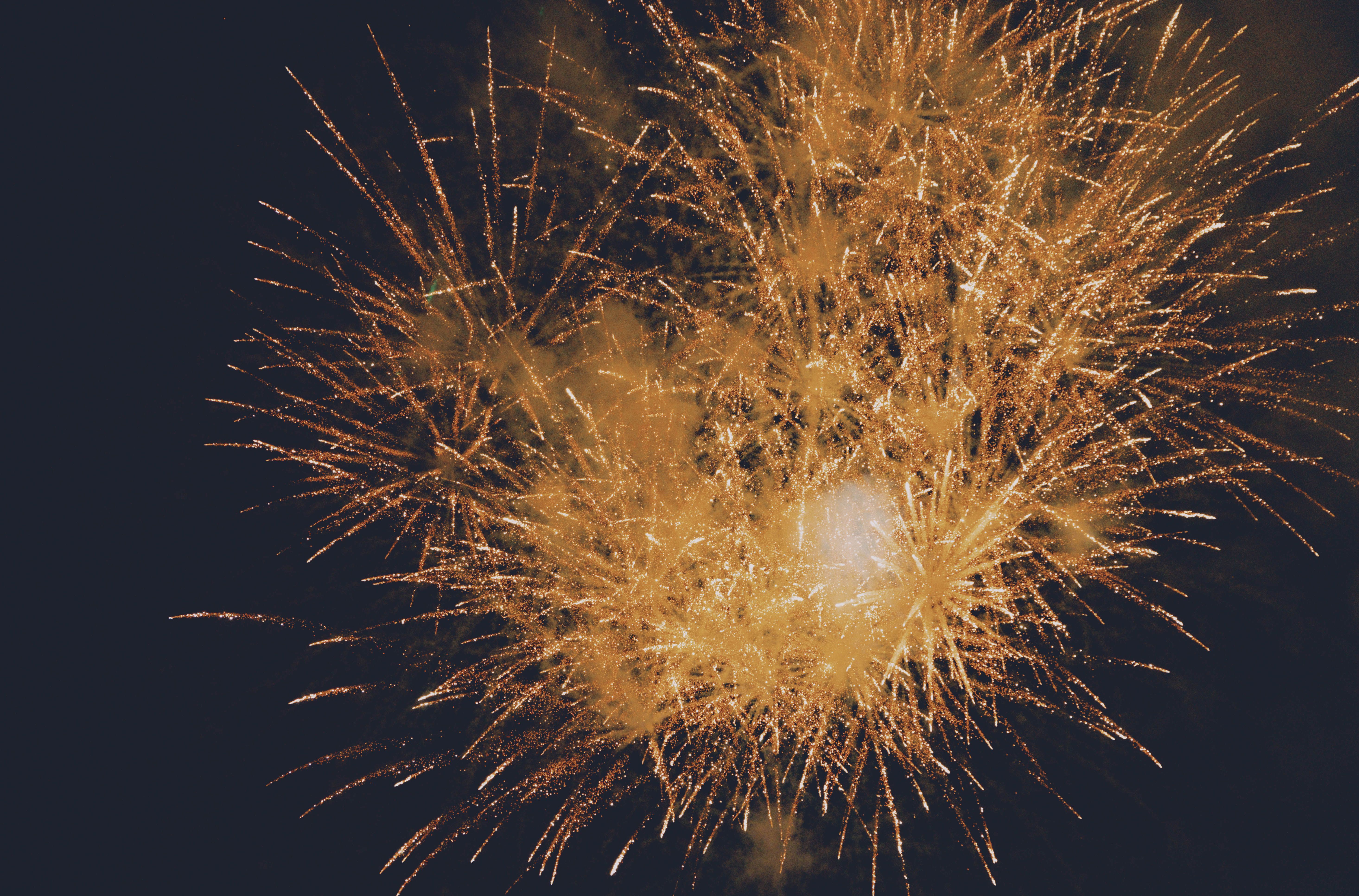 Golden fireworks exploding against a night sky, representing Fourth of July DUI enforcement in New Jersey