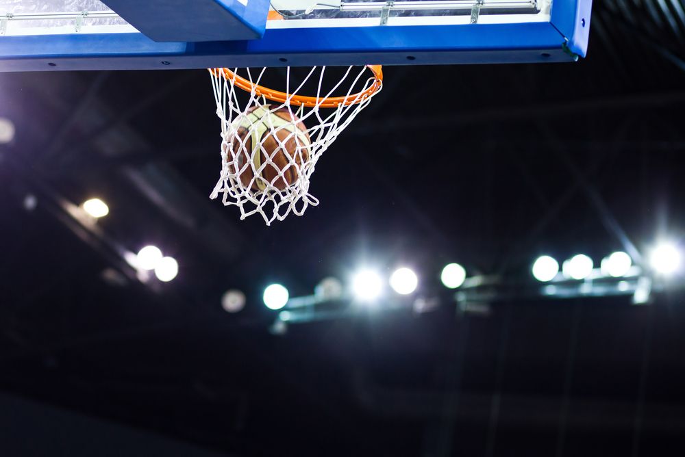 Basketball going through hoop during March Madness, representing increased DUI arrests after game night celebrations in New Jersey