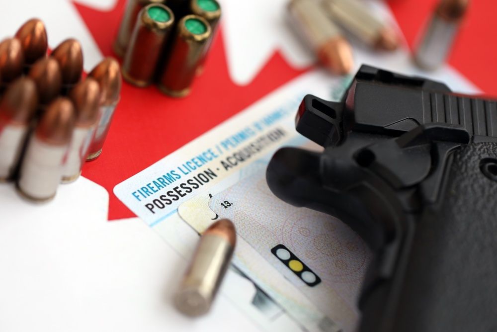 Handgun and ammunition placed on a New Jersey firearms license card, showing how age limits impact handgun permits in 2026