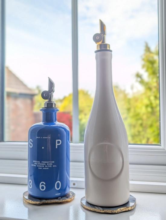 SP360 compared with Citizens of Soil reuseable olive oil bottle