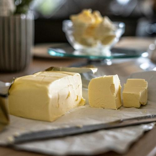 Butter on a countertop cut into cubes