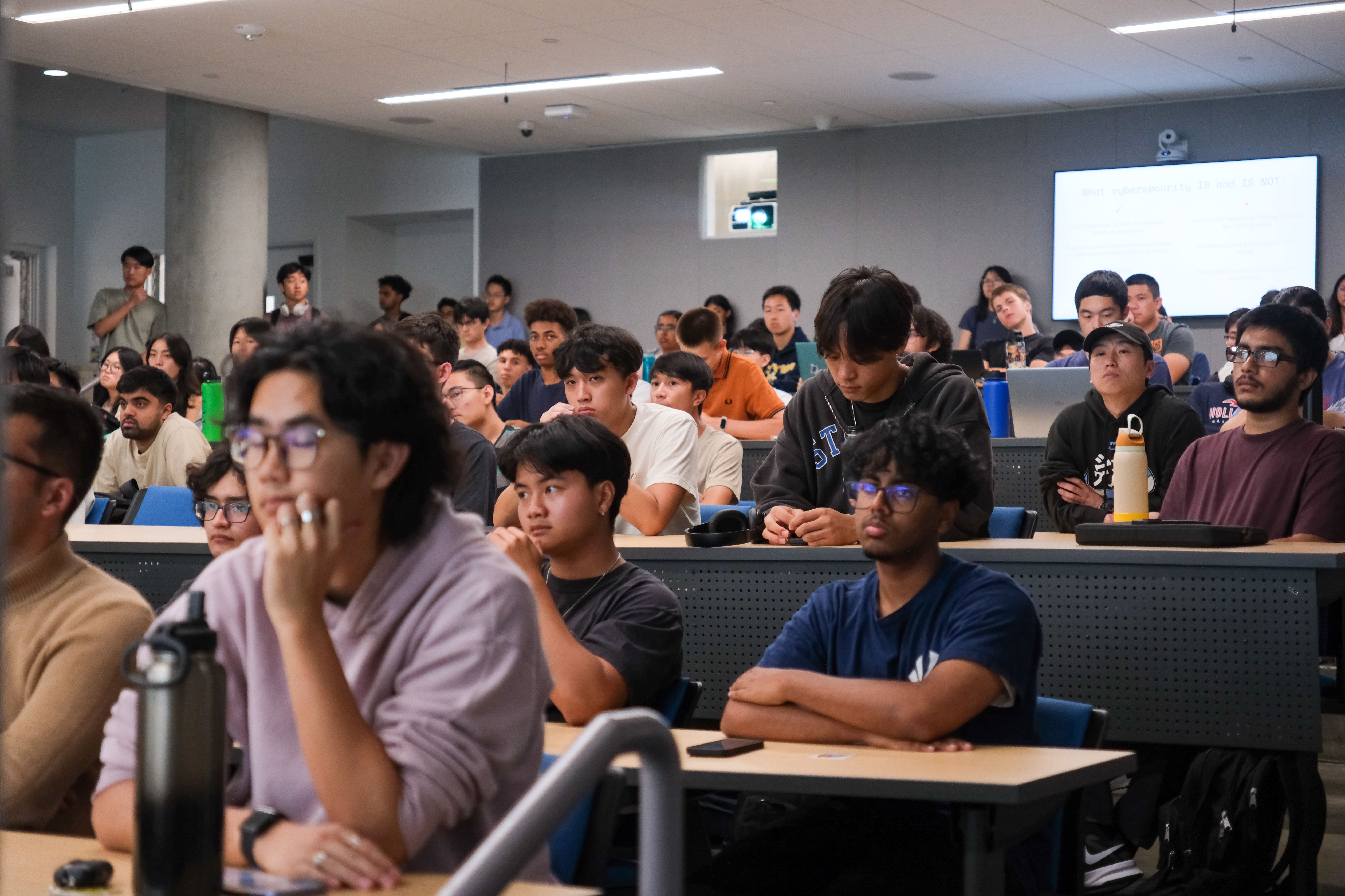 Cyber@UCI club members collaborating in the HackerLab.