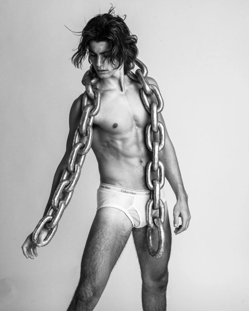 Model Corrado Martini, wearing a pair of white briefs, photographed for L'Officiel Hommes Poland shot by photographer Taylor Miller.
