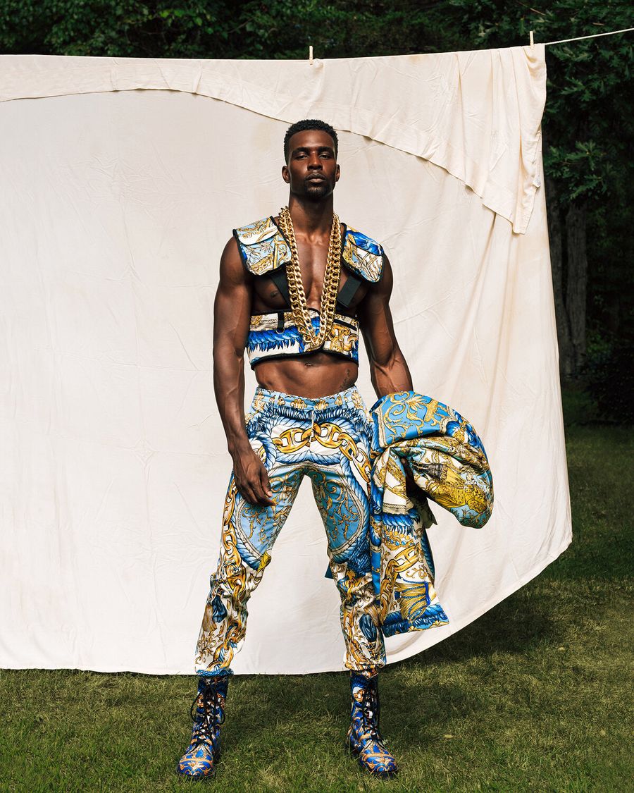 Model Joshua Cummings, wearing a full Moschino look, photographed for L'Officiel Hommes shot by photographer Taylor Miller.
