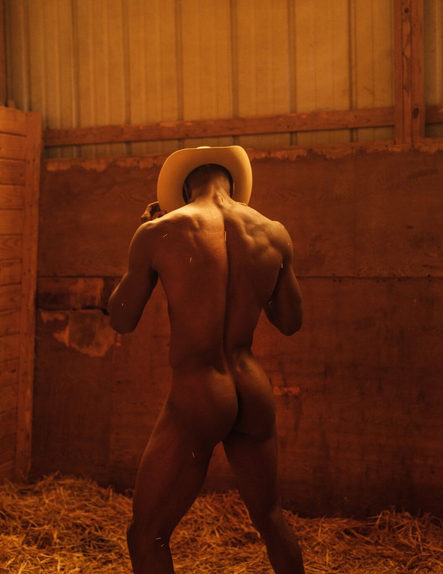 Model Joshua Cummings, wearing a cowboy hat, photographed for L'Officiel Hommes shot by photographer Taylor Miller.