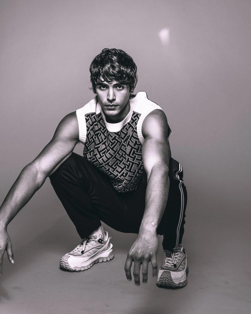 Model Sergio Perdomo, wearing a tank and pants, photographed for Numéro Netherlands shot by photographer Taylor Miller.