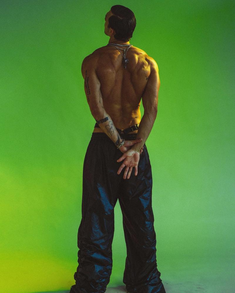 Model Christian Hogue, wearing a black leather pants, photographed for Numéro Netherlands shot by photographer Taylor Miller.