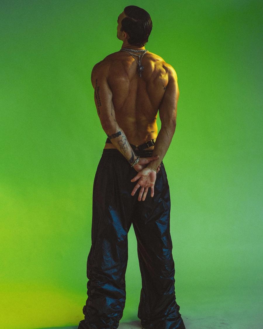 Model Christian Hogue, wearing a black leather pants, photographed for Numéro Netherlands shot by photographer Taylor Miller.