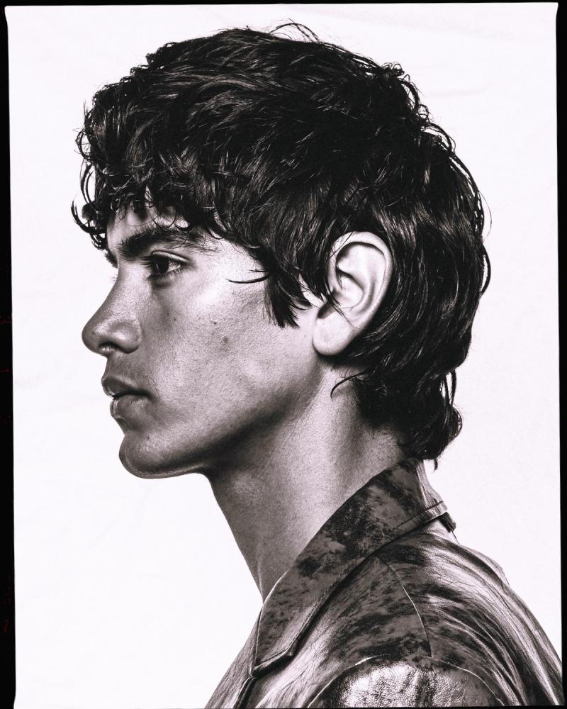 Model Sergio Perdomo, wearing a patterned jacket, photographed for Numéro Netherlands shot by photographer Taylor Miller.