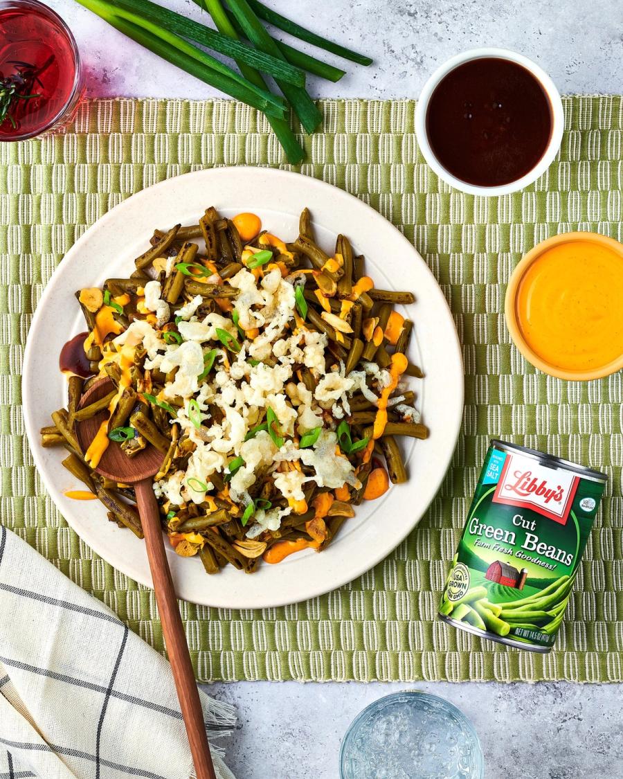 Plate of green beans, carrots and rice beside a Libby's Cut Green Beans can on a green striped mat, for Libby's and BuzzFeed by Taylor Miller.