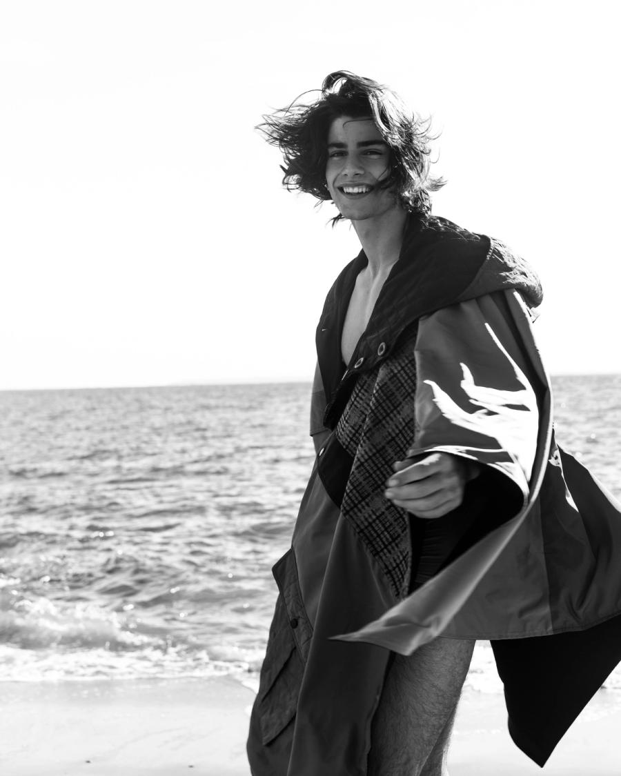 Model Corrado Martini, wearing an oversized poncho, photographed for L'Officiel Hommes Poland shot by photographer Taylor Miller.