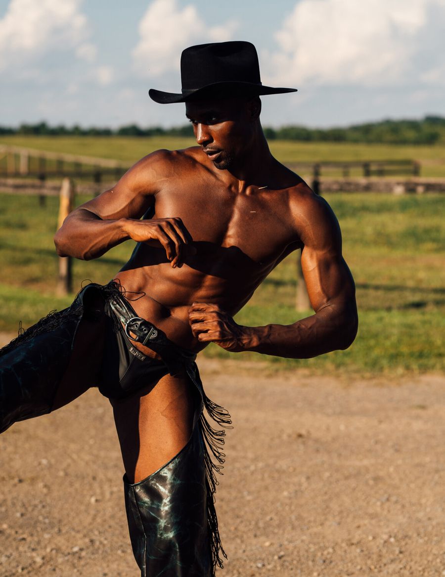 Model Joshua Cummings, wearing black chaps, photographed for L'Officiel Hommes shot by photographer Taylor Miller.