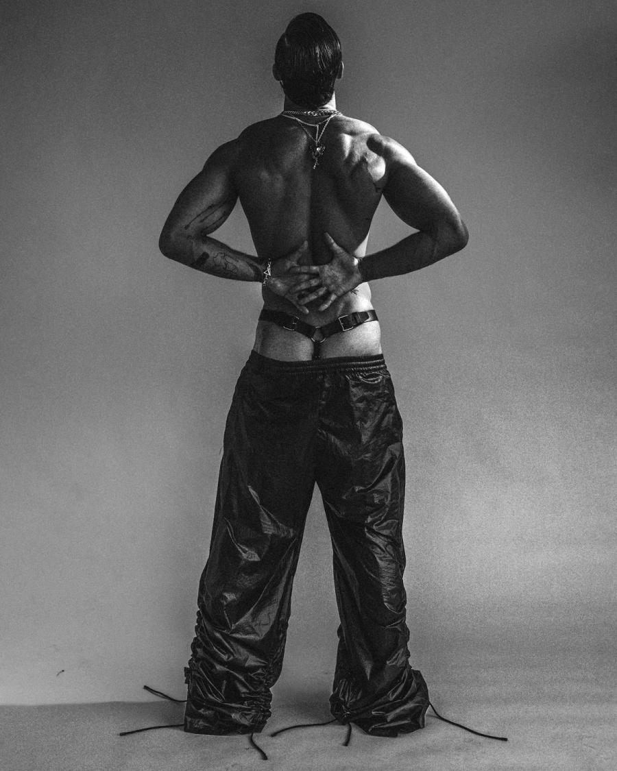 Model Christian Hogue, wearing a black leather pants, photographed for Numéro Netherlands shot by photographer Taylor Miller.