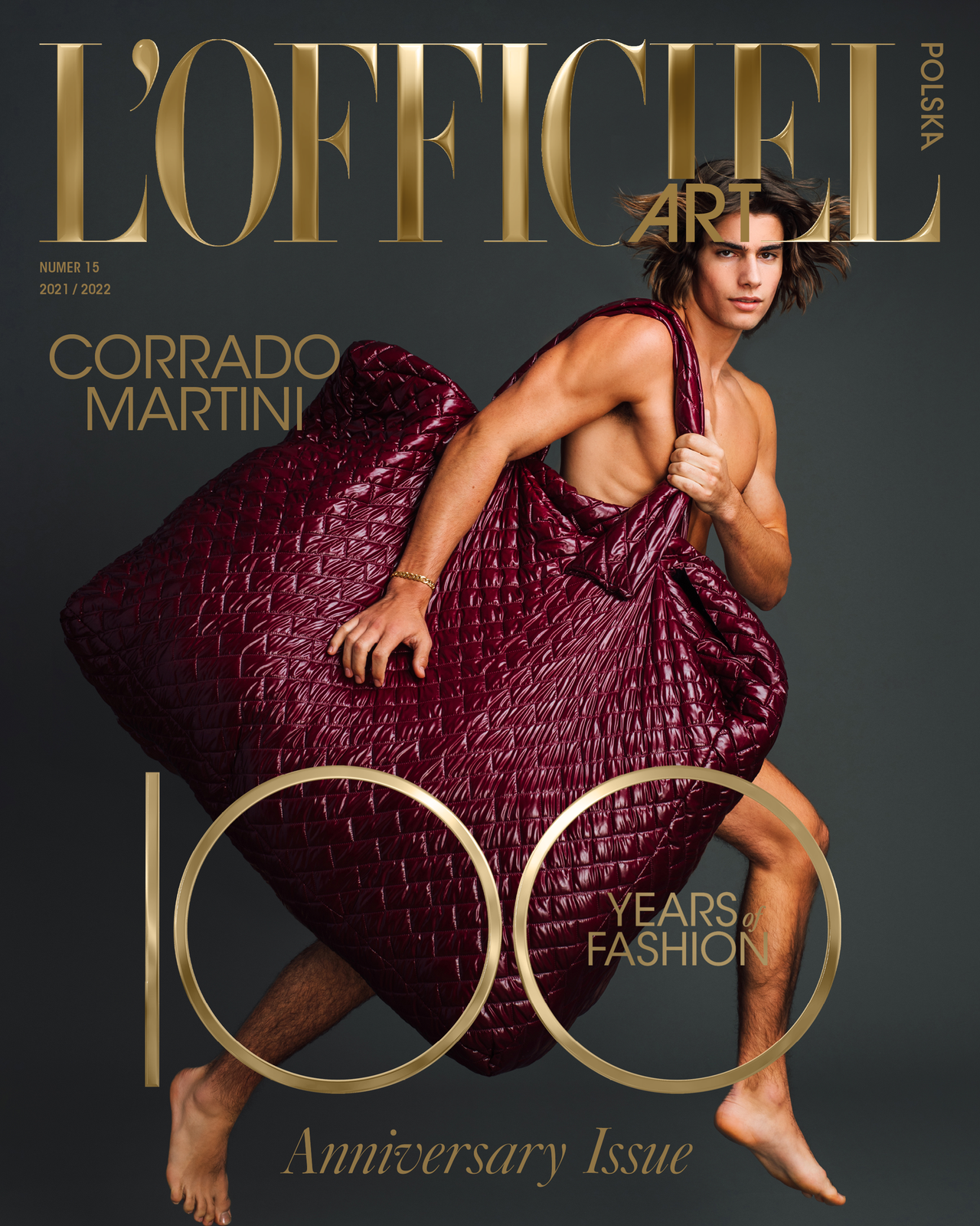 Model Corrado Martini, wearing a giant padded bag, photographed for L'OFFICIEL Hommes magazine by photographer Taylor Miller.