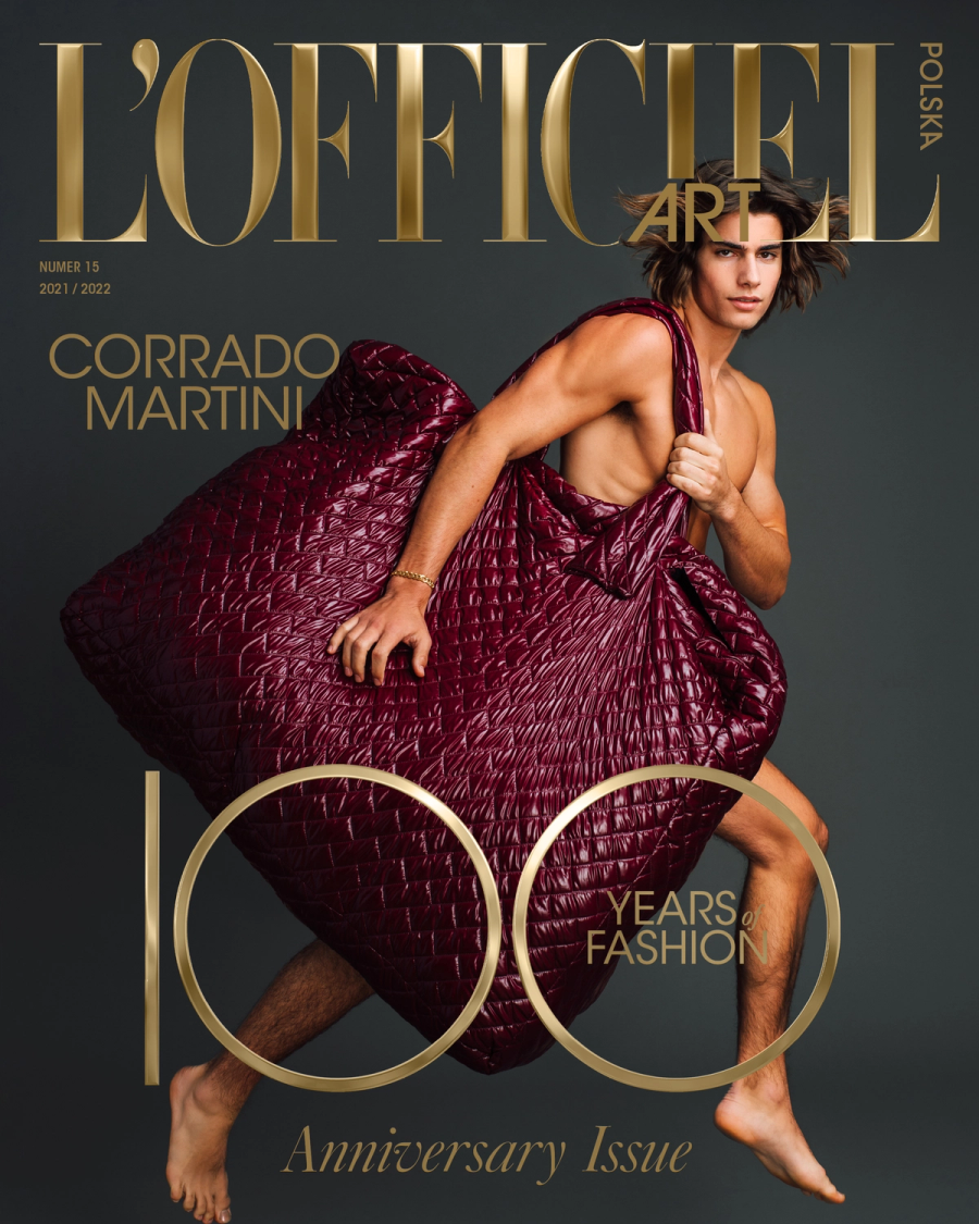 Model Corrado Martini, wearing a giant padded bag, photographed for L'OFFICIEL Hommes magazine by photographer Taylor Miller.