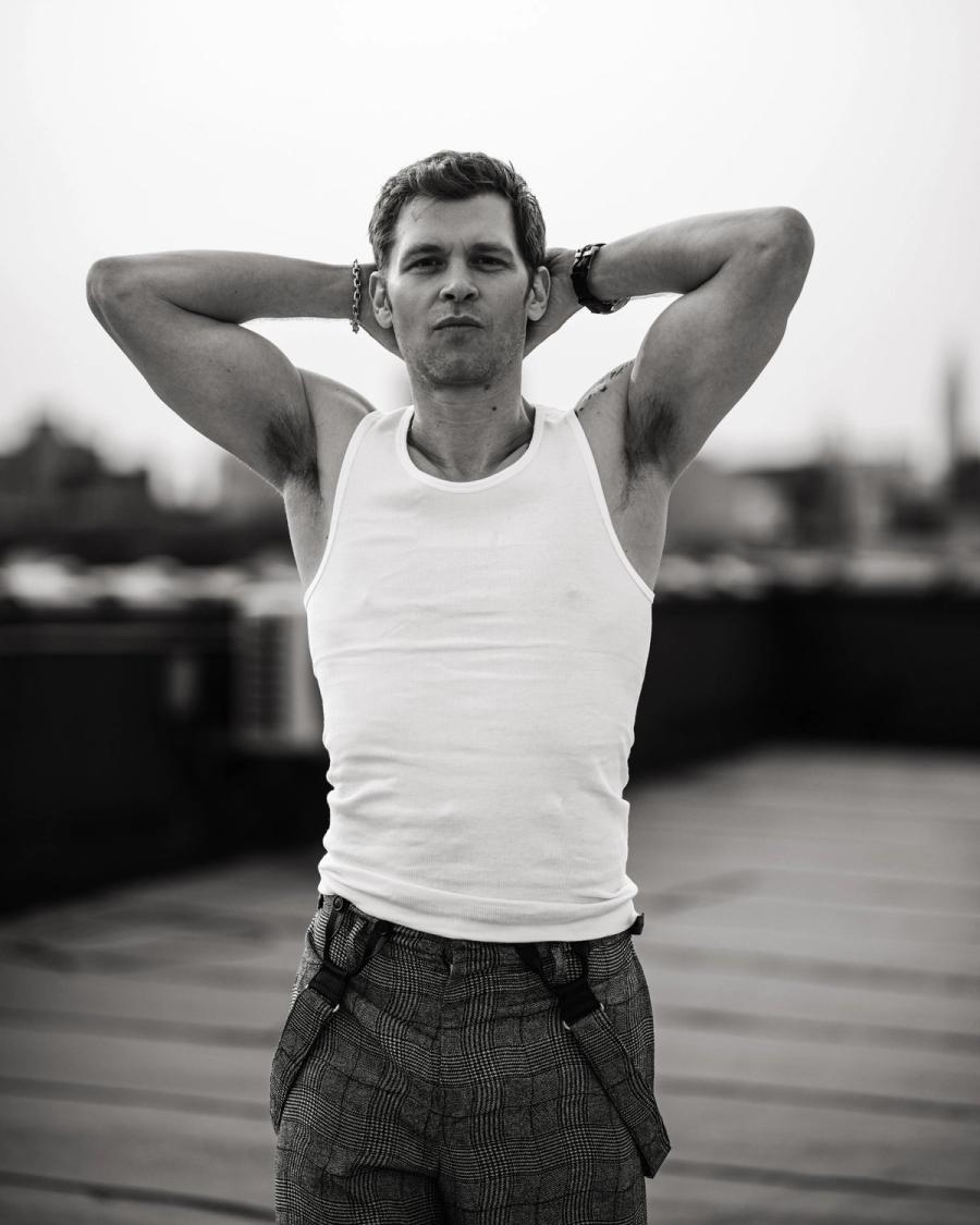 Actor Joseph Morgan, wearing a white tank top and grey patterned pants, photographed for Numéro Netherlands shot by photographer Taylor Miller.