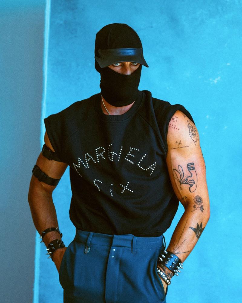 Model Christian Hogue, wearing a Margiela shirt and pants, photographed for Numéro Netherlands shot by photographer Taylor Miller.