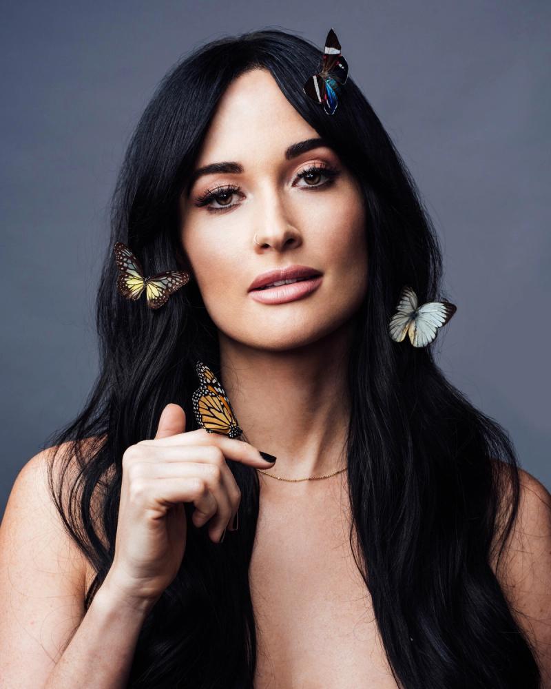 Singer Kacey Musgraves, wearing butterflies in her hair, photographed in New York City for BuzzFeed by celebrity and fashion photographer Taylor Miller.