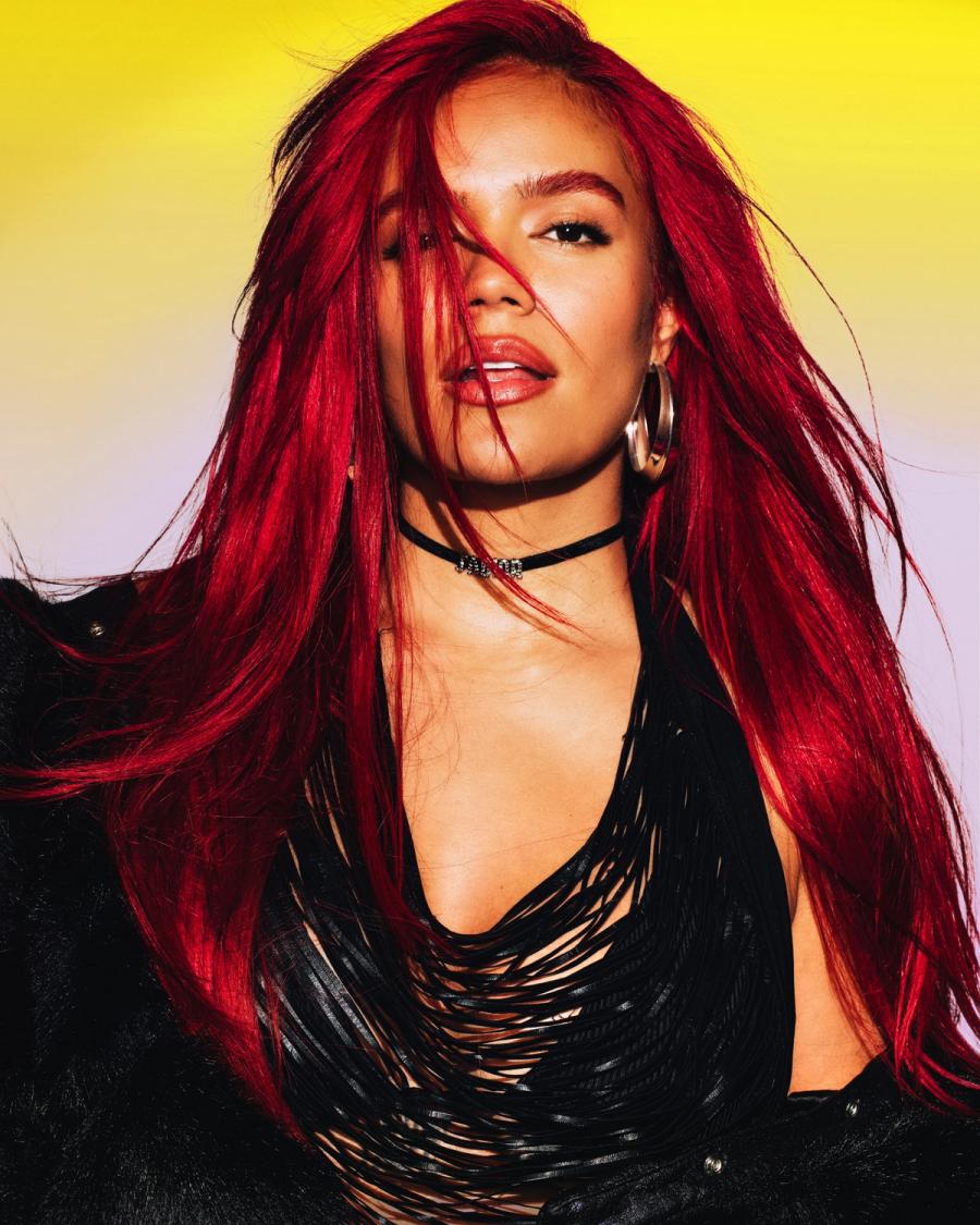 Singer Karol G, wearing a black modern top, photographed in New York City by fashion and celebrity photographer Taylor Miller who is located in Brooklyn, NY. 