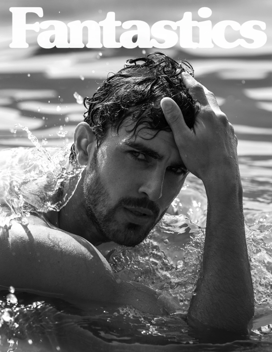 Clint Mauro emerging from water in a black and white portrait on the cover of Fantastics magazine, photographed by Taylor Miller.